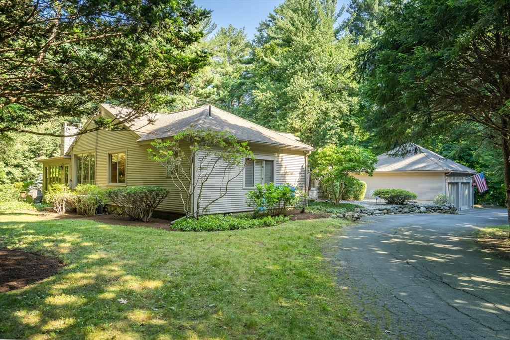 215 Mossman Road Sudbury, MA 01776 - Photo 2 of 30 a front view of a house with a yard