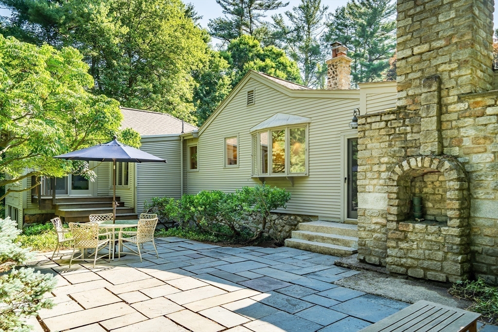 215 Mossman Road Sudbury, MA 01776 - Photo 25 of 30 a view of house with backyard and sitting area