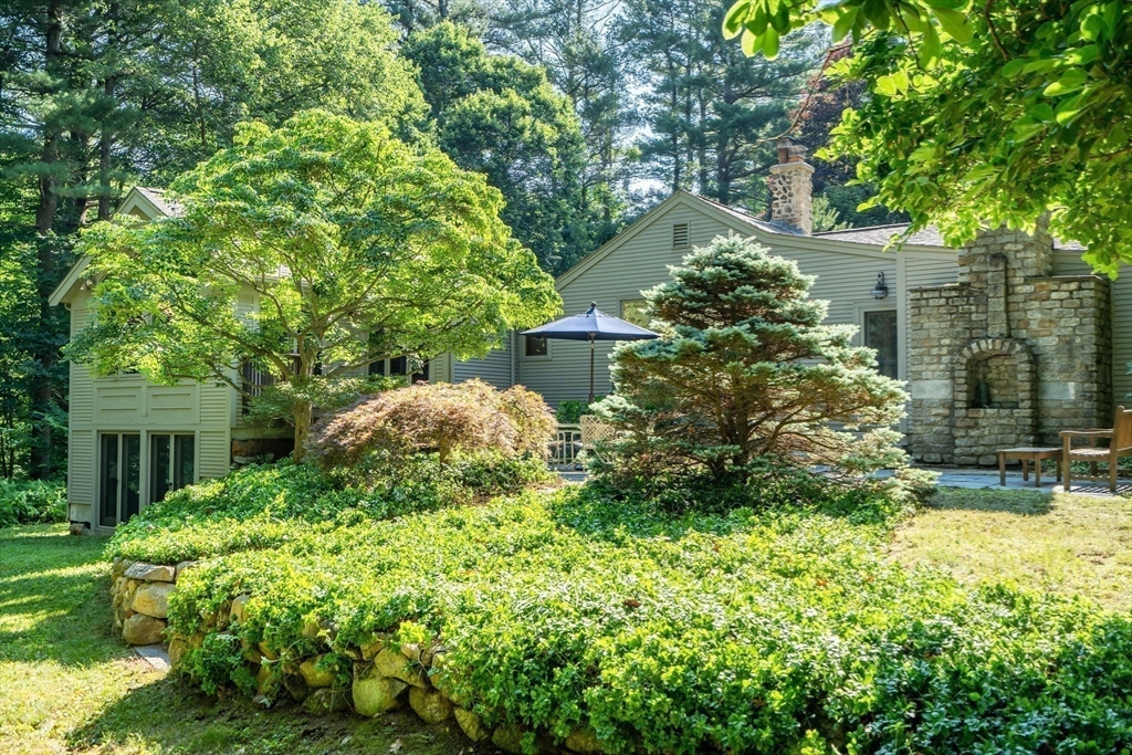 215 Mossman Road Sudbury, MA 01776 - Photo 27 of 30 a backyard of a house with lots of green space