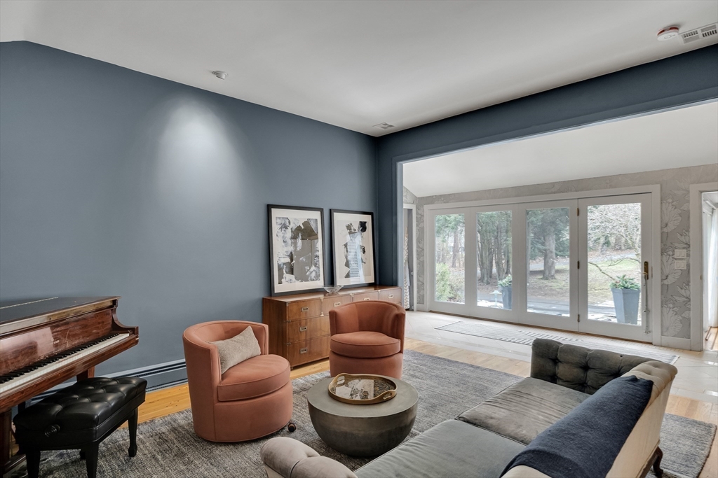 215 Mossman Road Sudbury, MA 01776 - Photo 7 of 30 a living room with furniture and large windows