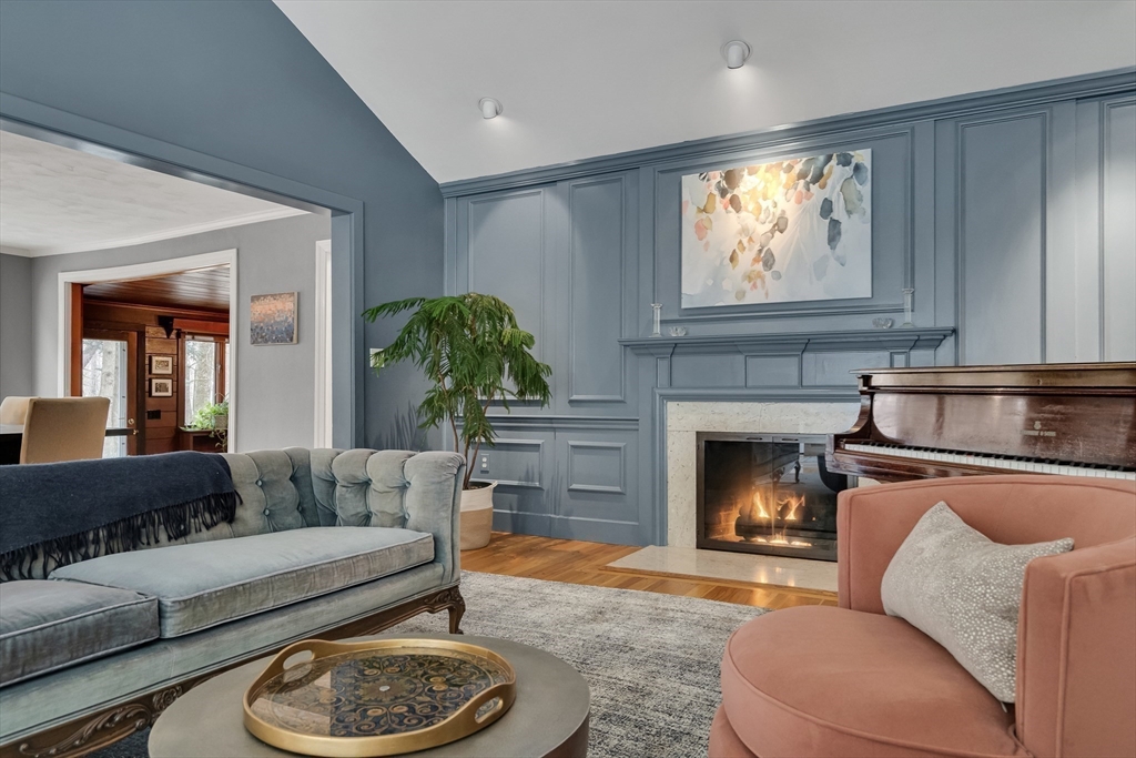 215 Mossman Road Sudbury, MA 01776 - Photo 8 of 30 a living room with furniture a window and a fireplace