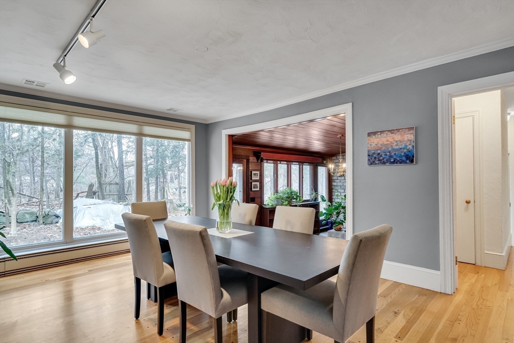 215 Mossman Road Sudbury, MA 01776 - Photo 9 of 30 a view of a dining room with furniture window and wooden floor