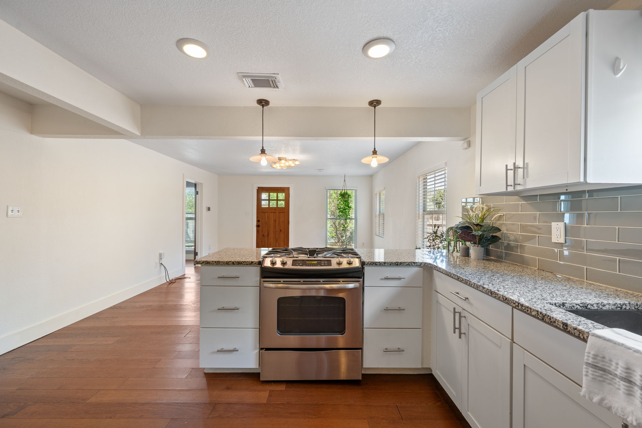 1137 Nickols Avenue Austin, TX 78721 - Photo 12 of 33 Range overlooks the living area, perfect for entertaining. Host your own cooking show here!