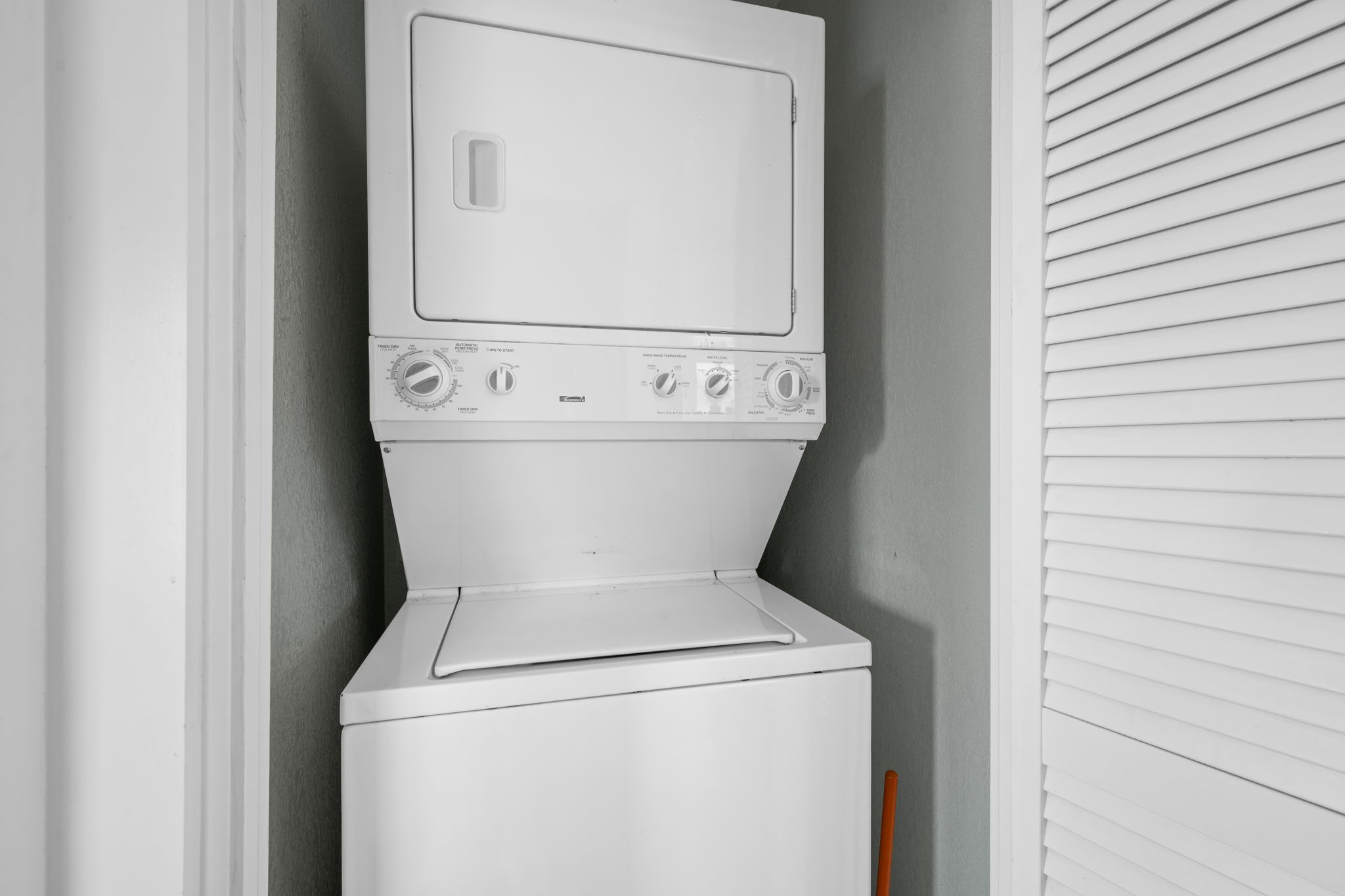 1137 Nickols Avenue Austin, TX 78721 - Photo 18 of 33 Stackable washer and dryer in a closet in primary bathroom.