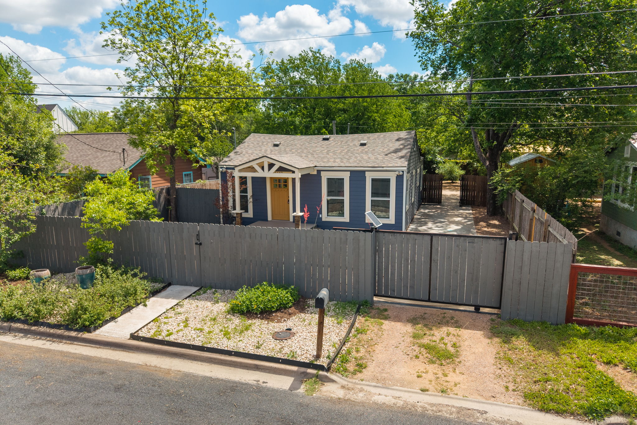 1137 Nickols Avenue Austin, TX 78721 - Photo 2 of 33 Gated with a solar powered sliding gate for privacy.