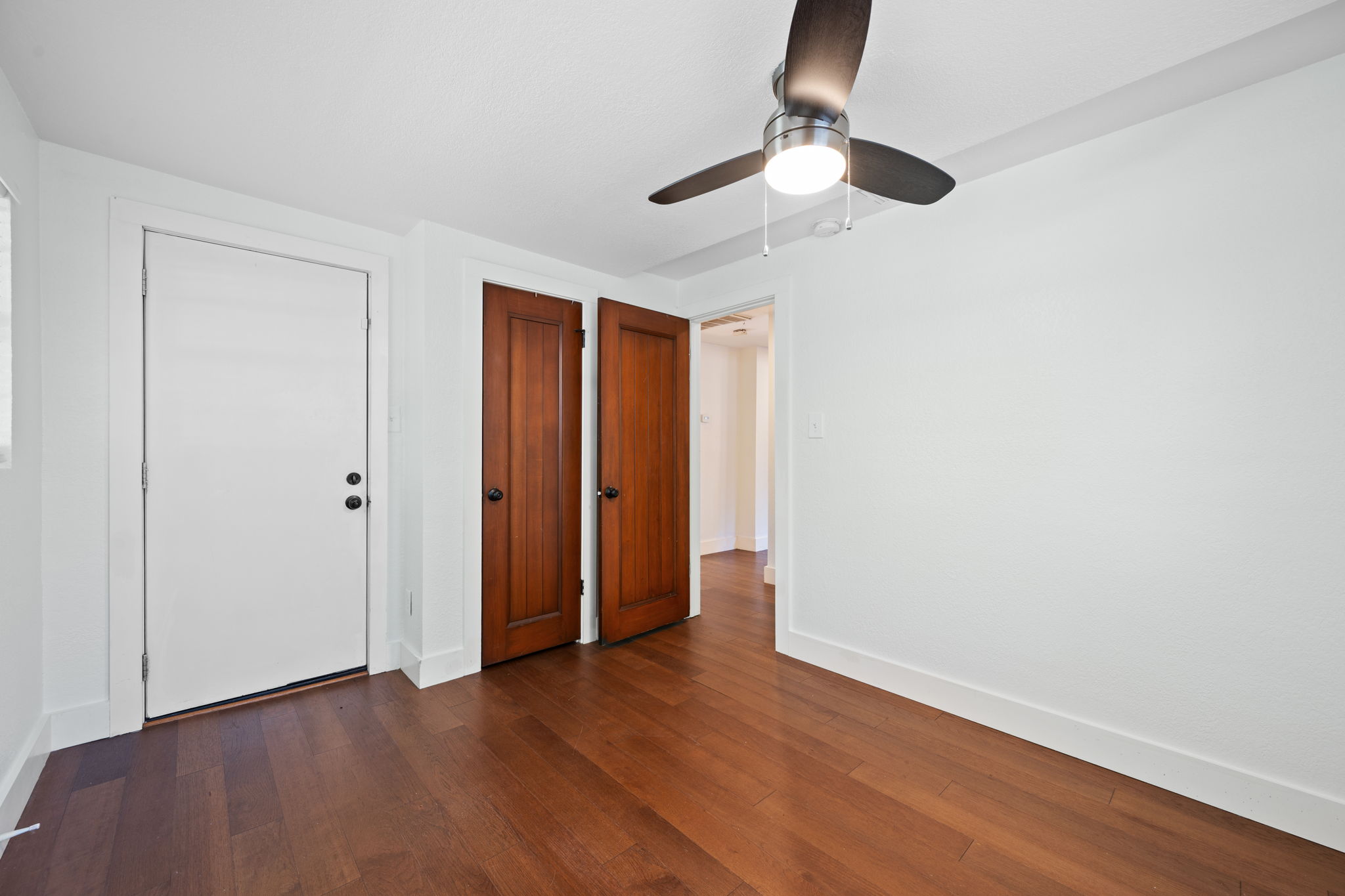 1137 Nickols Avenue Austin, TX 78721 - Photo 23 of 33 Bedroom 3 with a door that goes to the back patio.