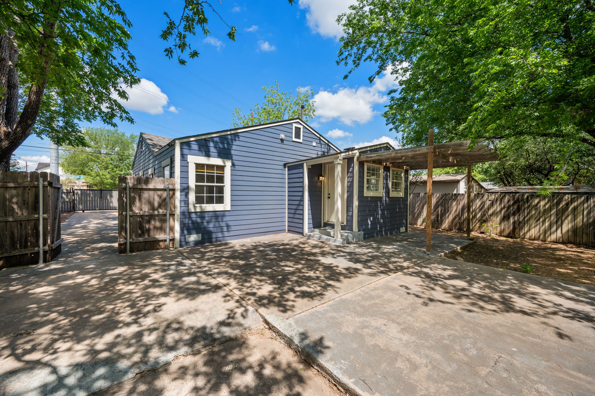1137 Nickols Avenue Austin, TX 78721 - Photo 25 of 33 Back of house with a patio area. Long driveway for extra parking or RV, boat or work vehicle storage.