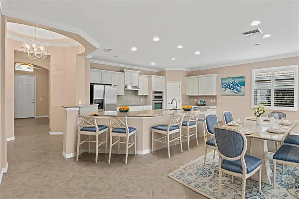 a view of an empty room with a ceiling fan