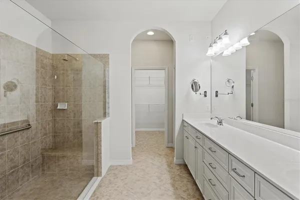 an empty room and a bathroom with a toilet