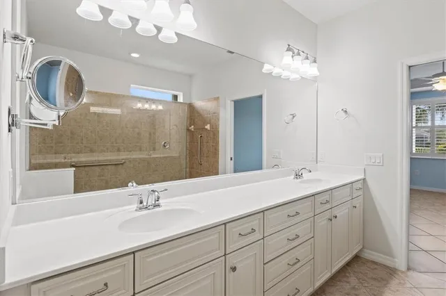 a row of palm trees and swimming pool in the backyard of a house