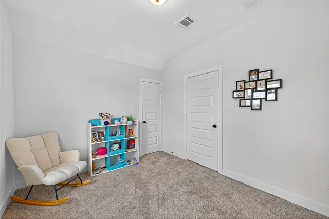 a room with furniture and white walls
