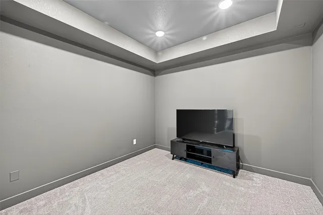 a room with furniture and flat screen tv