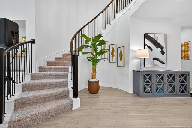 a view of staircase with wooden floor and stairs