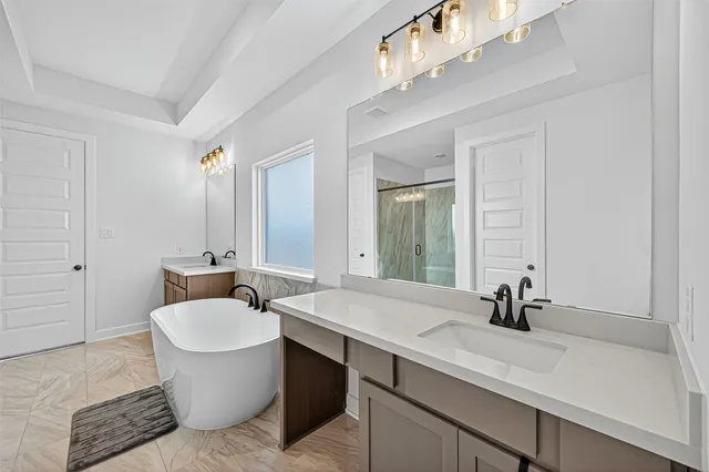 a bathroom with a sink and a large mirror