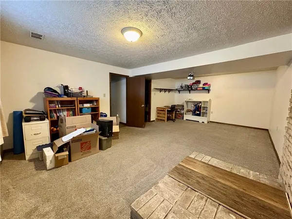 a view of a room with furniture and toys
