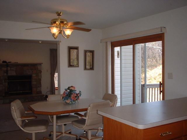 5553 Granite Road Long Pond, PA 18334 - Photo 1 of 8 a view of a dining room with furniture window and wooden floor