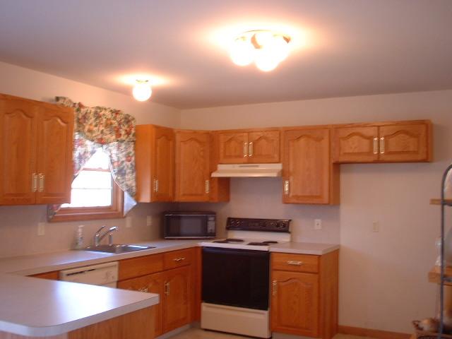 5553 Granite Road Long Pond, PA 18334 - Photo 4 of 8 a kitchen with stainless steel appliances granite countertop a sink and a stove