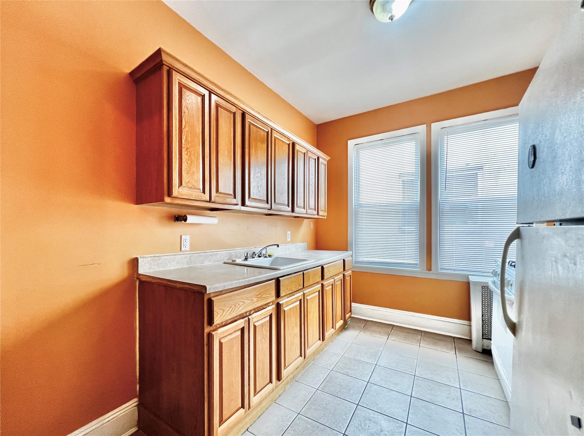 6700 49th Avenue Queens, NY 11377 - Photo 3 of 11 a bathroom with a sink a bath tub and a shower