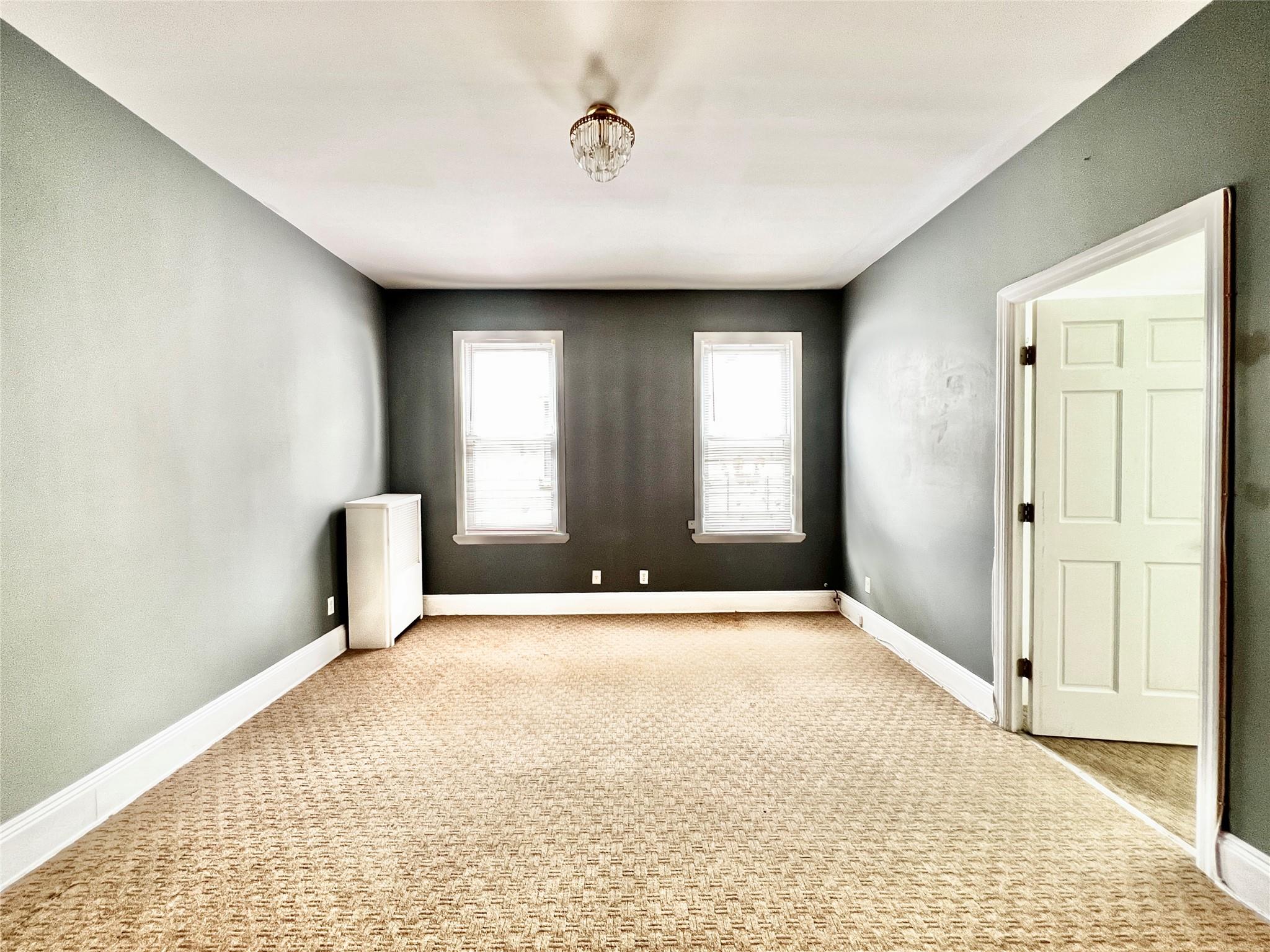 6700 49th Avenue Queens, NY 11377 - Photo 6 of 11 a view of an empty room with a window