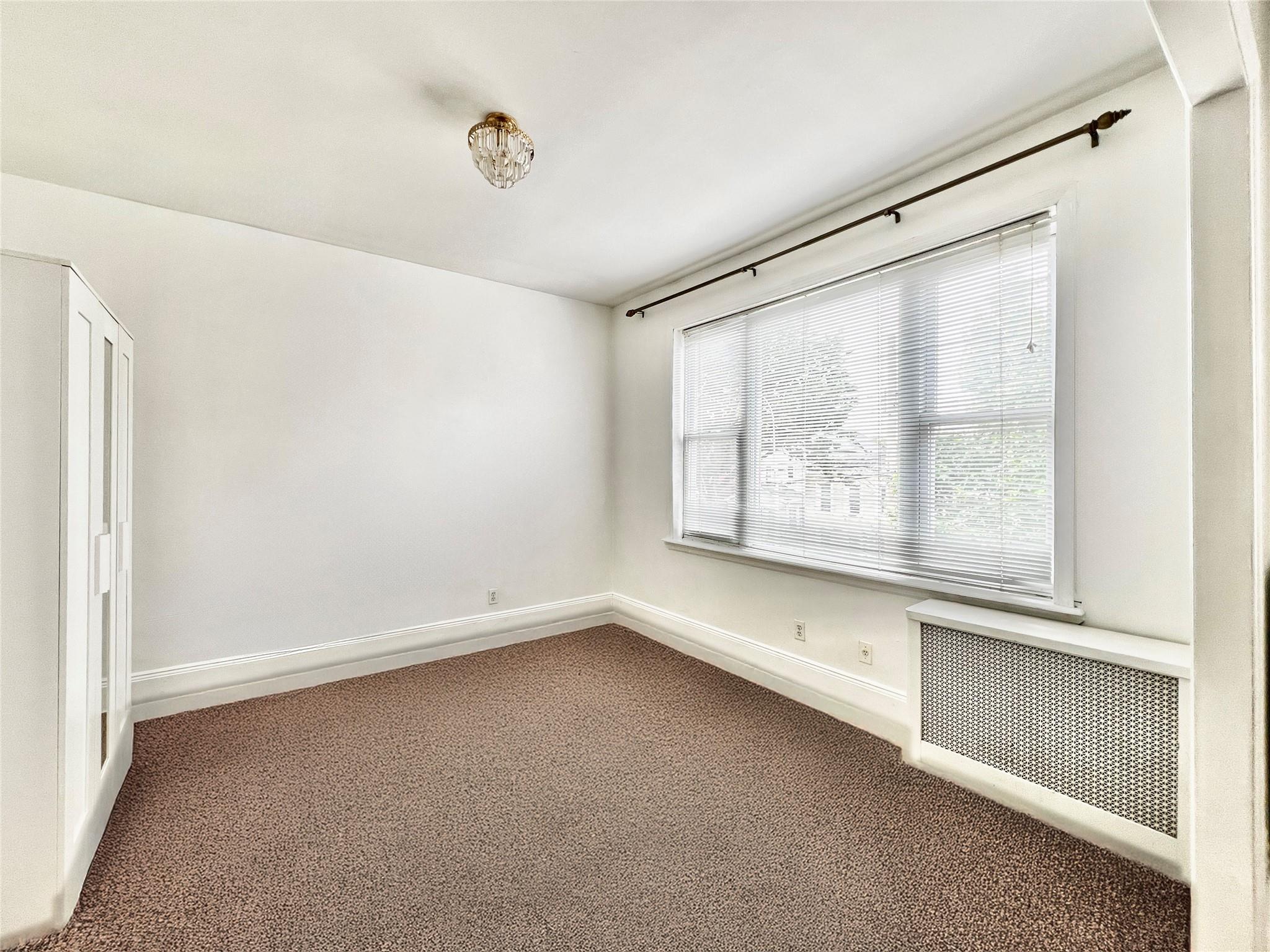 6700 49th Avenue Queens, NY 11377 - Photo 7 of 11 a view of room with window and hallway