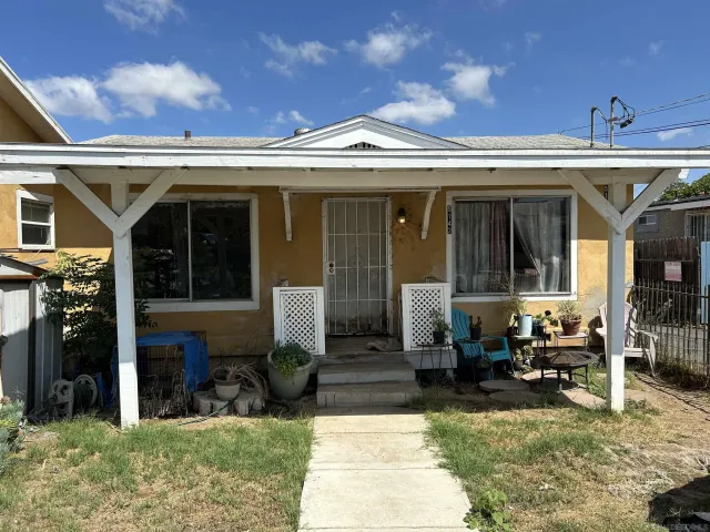 a view of a building with sitting space and garden