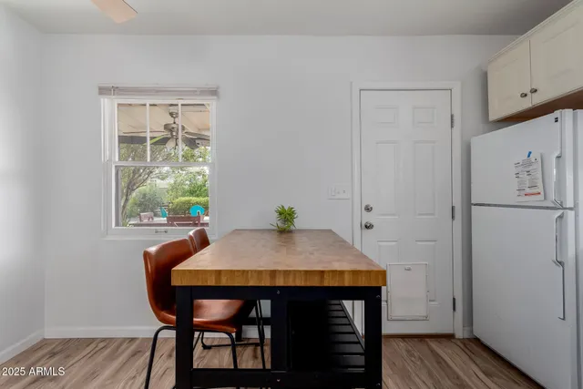 a kitchen with granite countertop a sink stove and cabinets
