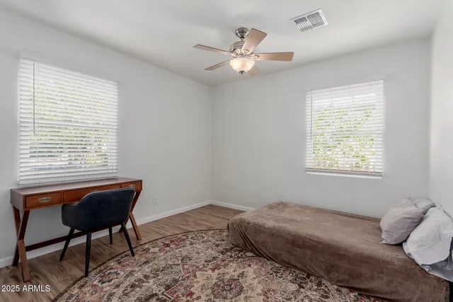 a view of a backyard with sitting area