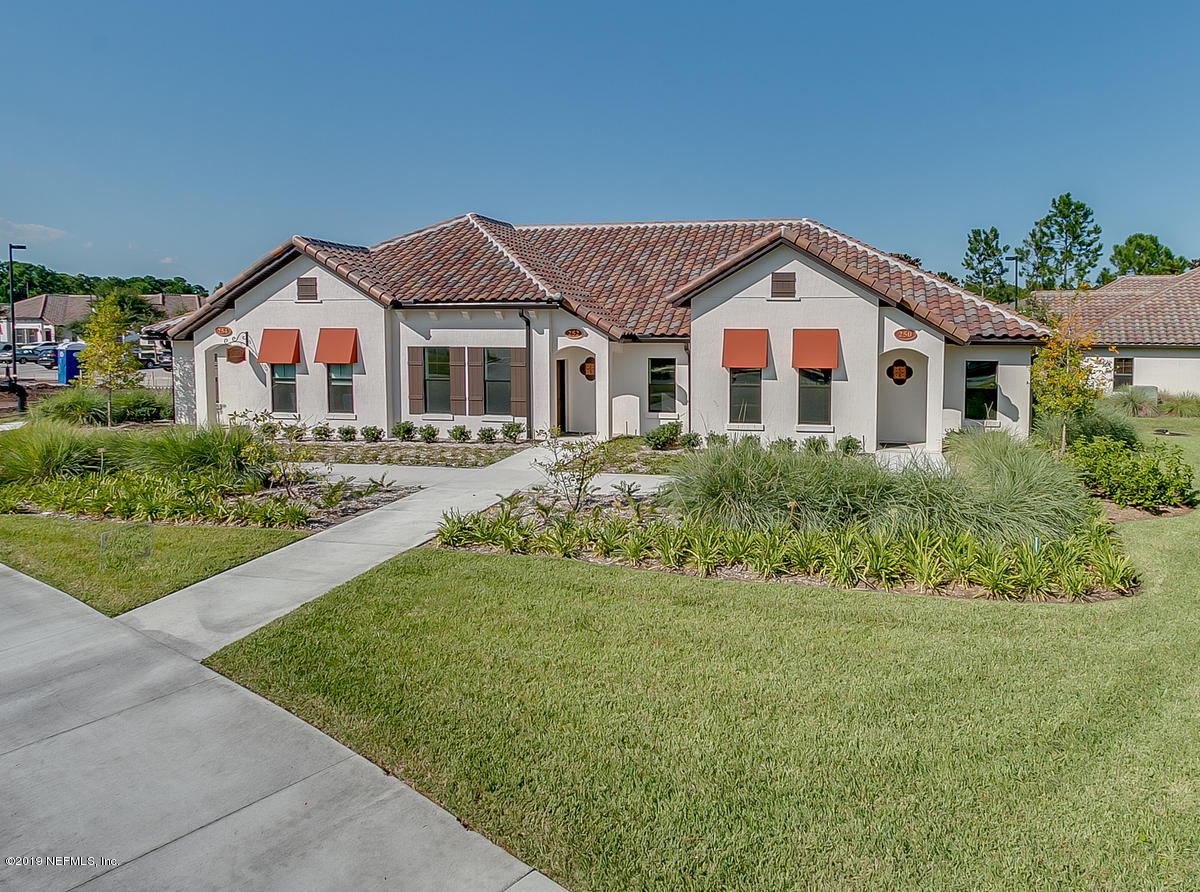 252 Paseo Reyes Drive St. Augustine, FL 32095 - Photo 2 of 15 a front view of a house with a yard