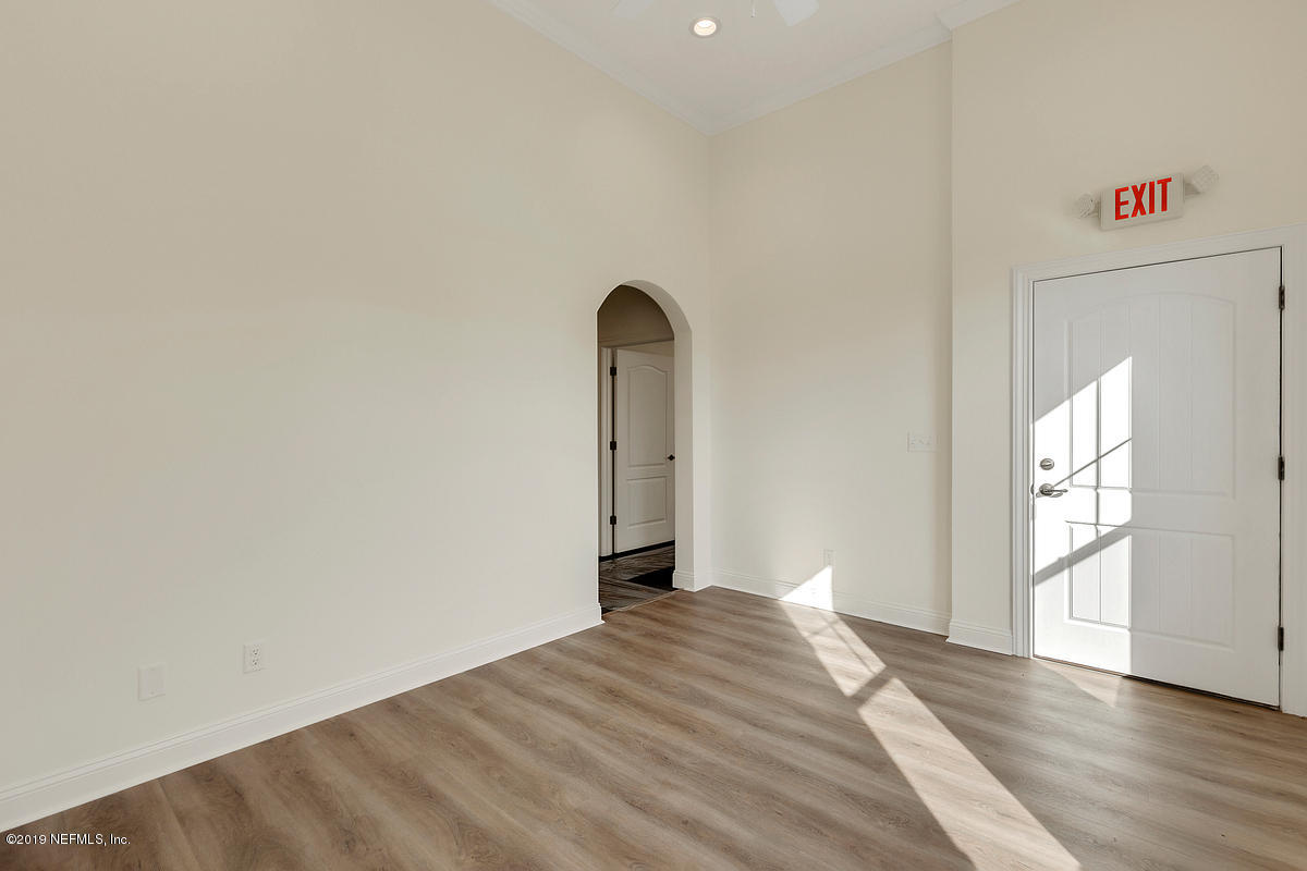 252 Paseo Reyes Drive St. Augustine, FL 32095 - Photo 4 of 15 a view of a room with wooden floor and window