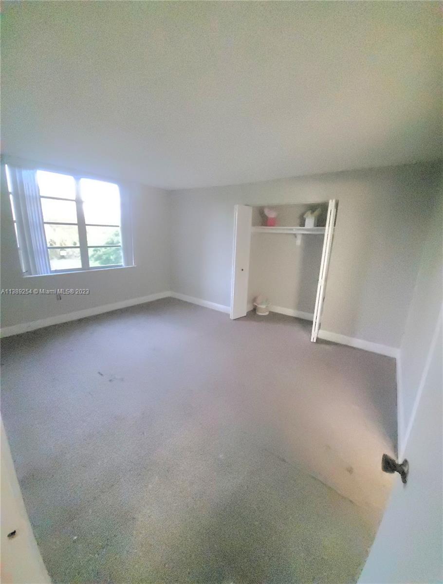 3490 Foxcroft Road, Unit B202 Miramar, FL 33025 - Photo 21 of 29 an empty room with windows