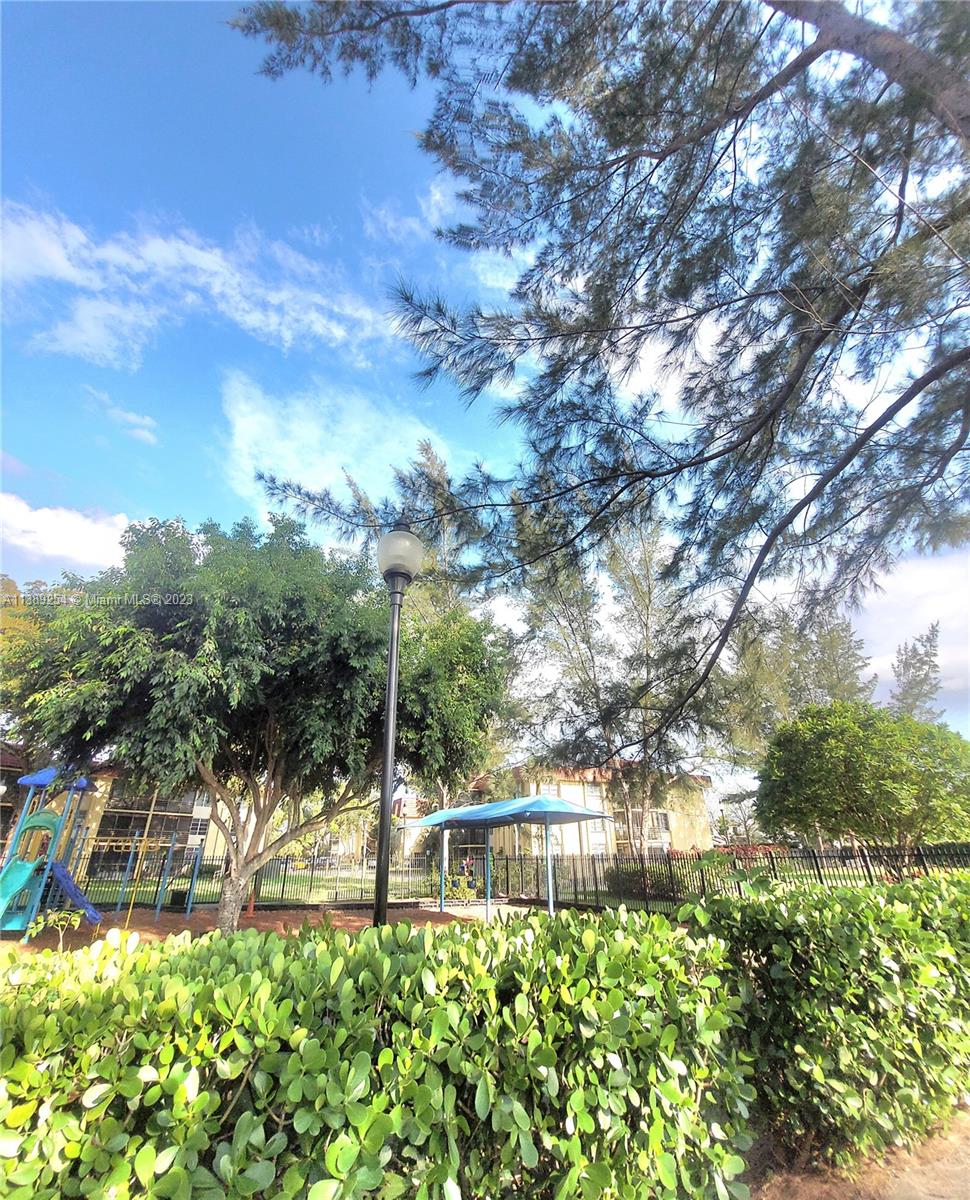 3490 Foxcroft Road, Unit B202 Miramar, FL 33025 - Photo 3 of 29 a view of yard with green space