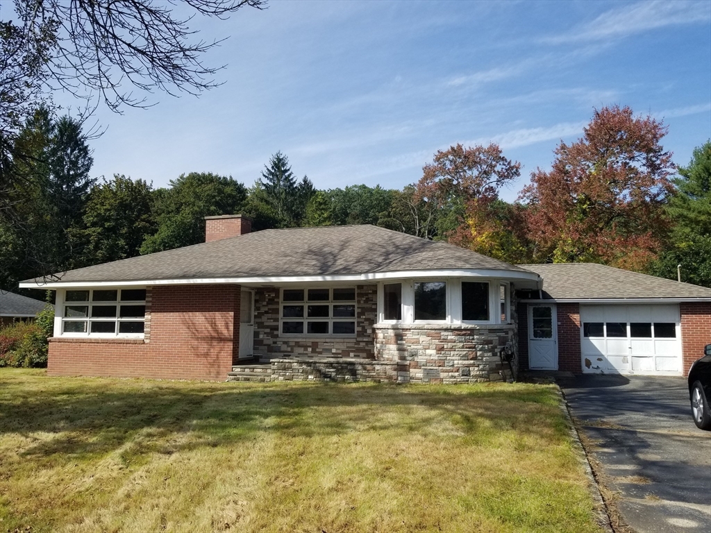 84 Greenwich Road Ware, MA 01082 - Photo 1 of 11 a front view of a house with a yard table and chairs