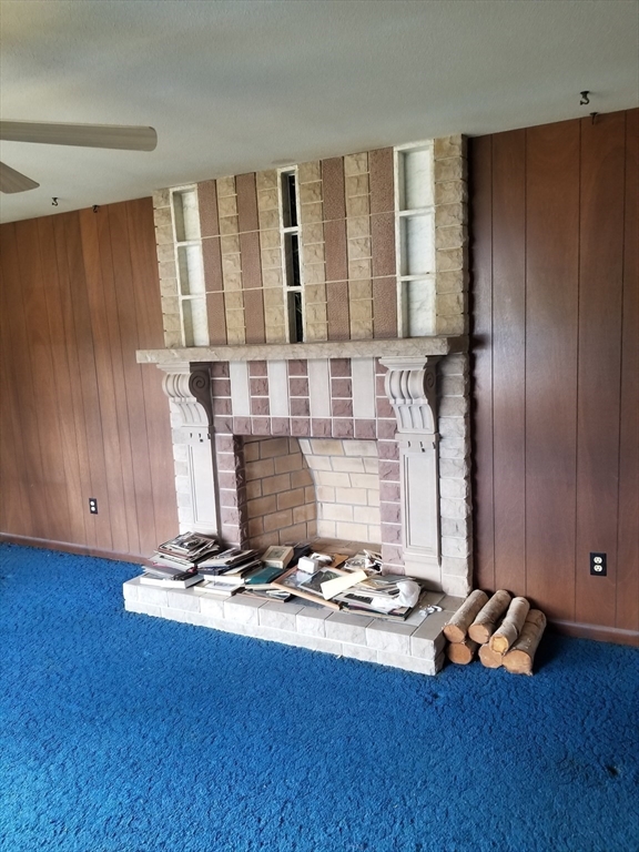 84 Greenwich Road Ware, MA 01082 - Photo 5 of 11 a living room with hard wood floors and gym equipment