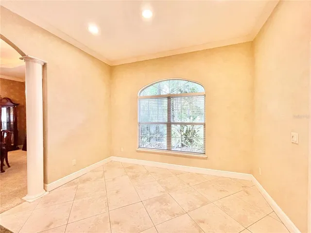 a living room with furniture window and a fireplace