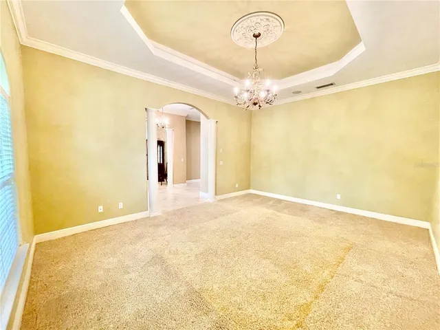 a spacious bathroom with a double vanity sink a mirror a bathtub and a shower