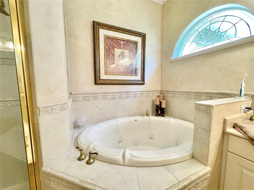 1501 Northwest 98 Street Gainesville, FL 32606 - Photo 44 of 92 a bathroom with a bathtub and a shower