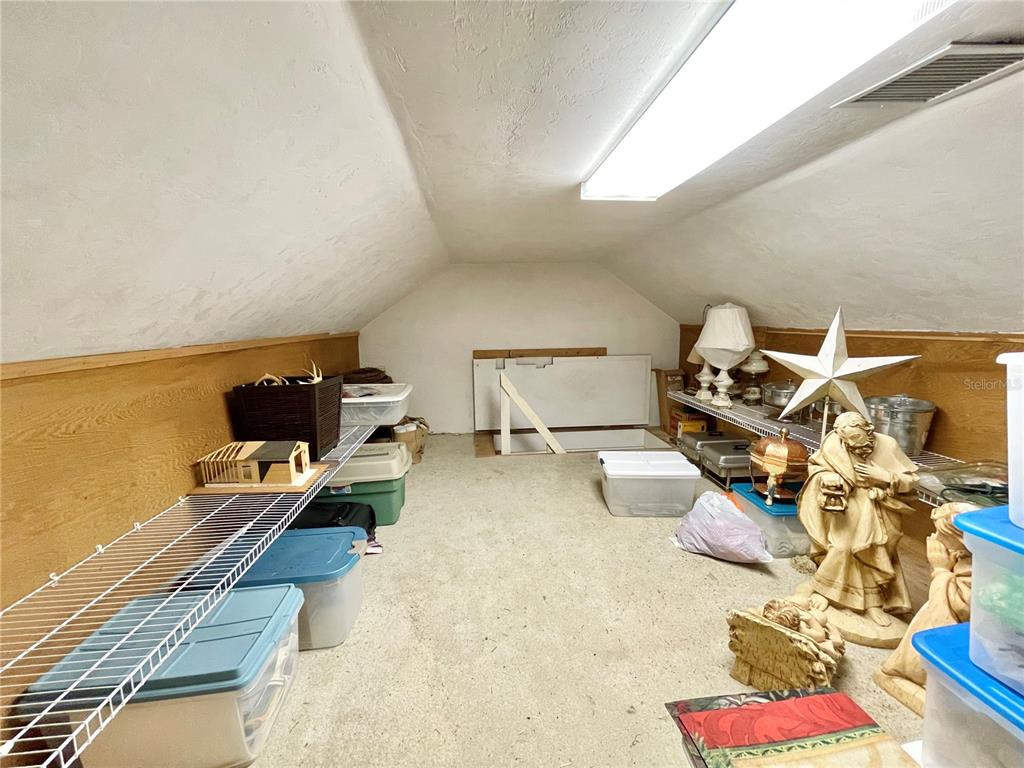 1501 Northwest 98 Street Gainesville, FL 32606 - Photo 73 of 92 a bedroom with furniture and a wooden floor