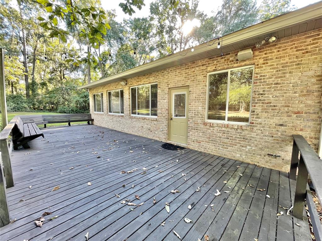 1501 Northwest 98 Street Gainesville, FL 32606 - Photo 90 of 92 a view of a house with wooden deck