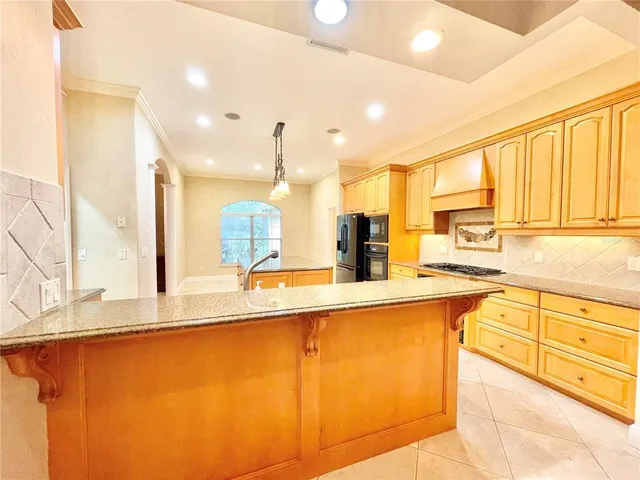 a dining room with furniture a chandelier and a rug