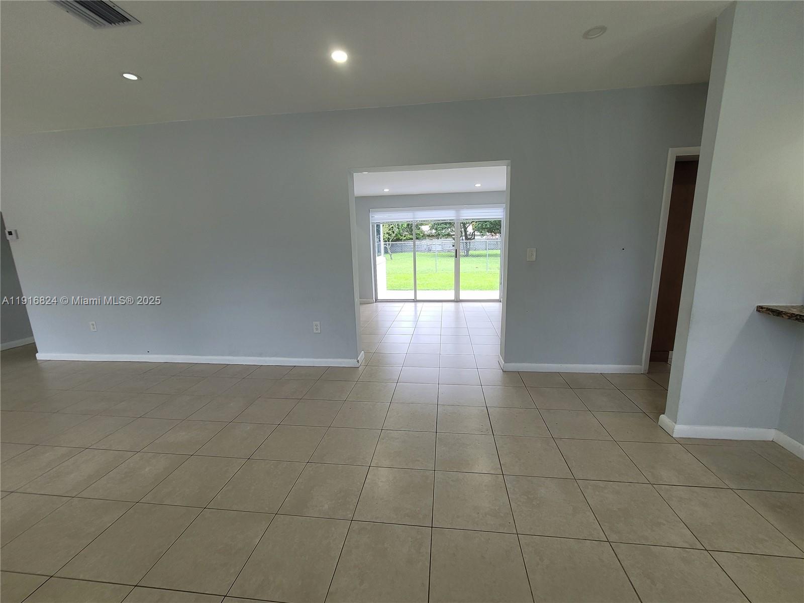 8839 Southwest 28th Street Miami, FL 33165 - Photo 13 of 29 a view of an empty room and window