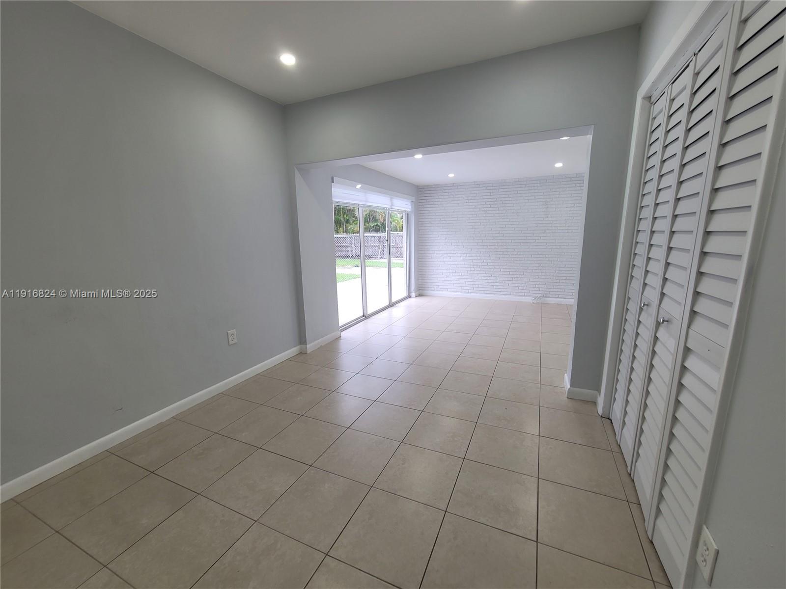 8839 Southwest 28th Street Miami, FL 33165 - Photo 16 of 29 a view of an empty room and a window