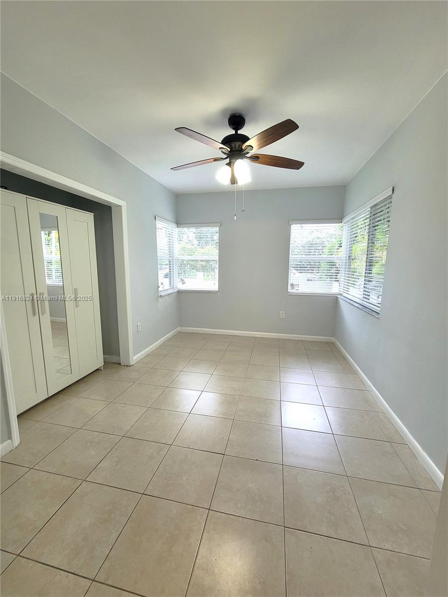 8839 Southwest 28th Street Miami, FL 33165 - Photo 25 of 29 a view of an empty room with a window