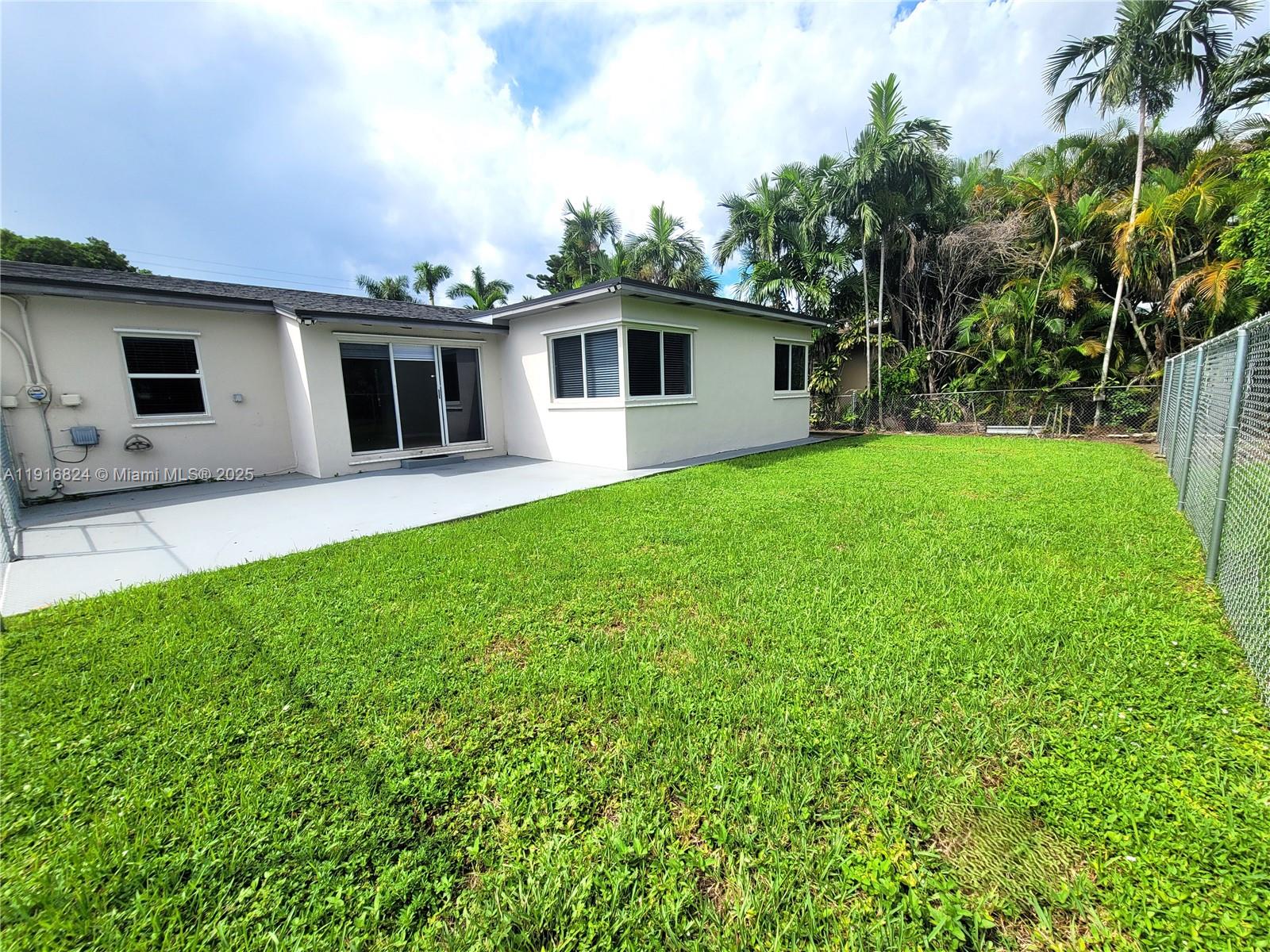 8839 Southwest 28th Street Miami, FL 33165 - Photo 26 of 29 a front view of a house with garden