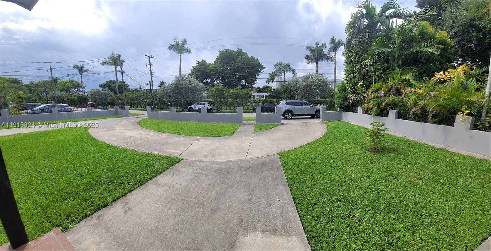 8839 Southwest 28th Street Miami, FL 33165 - Photo 3 of 29 a view of a garden with houses