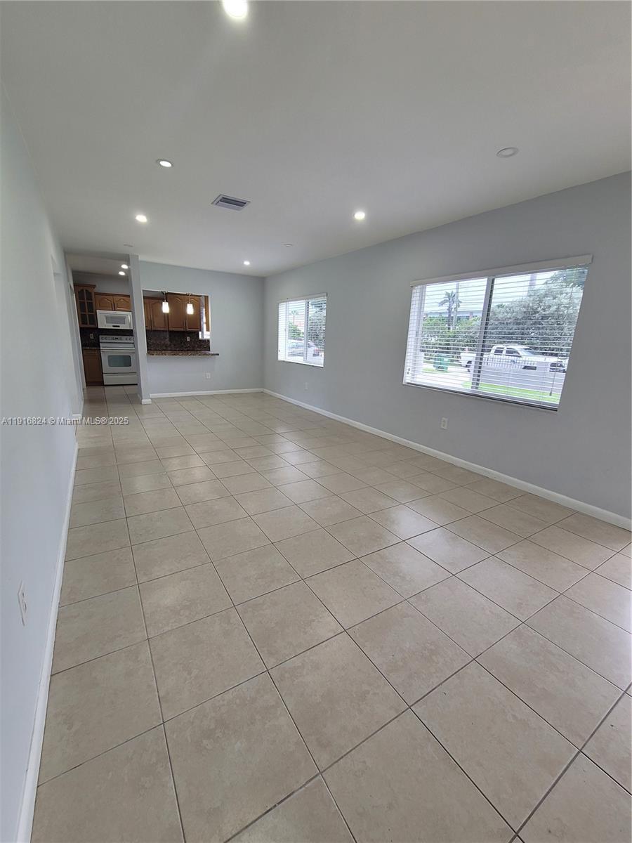 8839 Southwest 28th Street Miami, FL 33165 - Photo 4 of 29 a view of a livingroom with furniture and window
