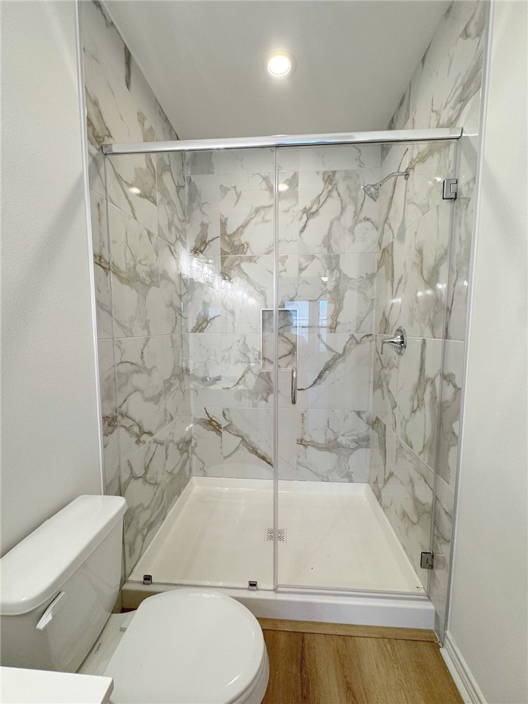2105 Fury Portland, TX 78374 - Photo 11 of 19 a bathroom with a toilet and a shower