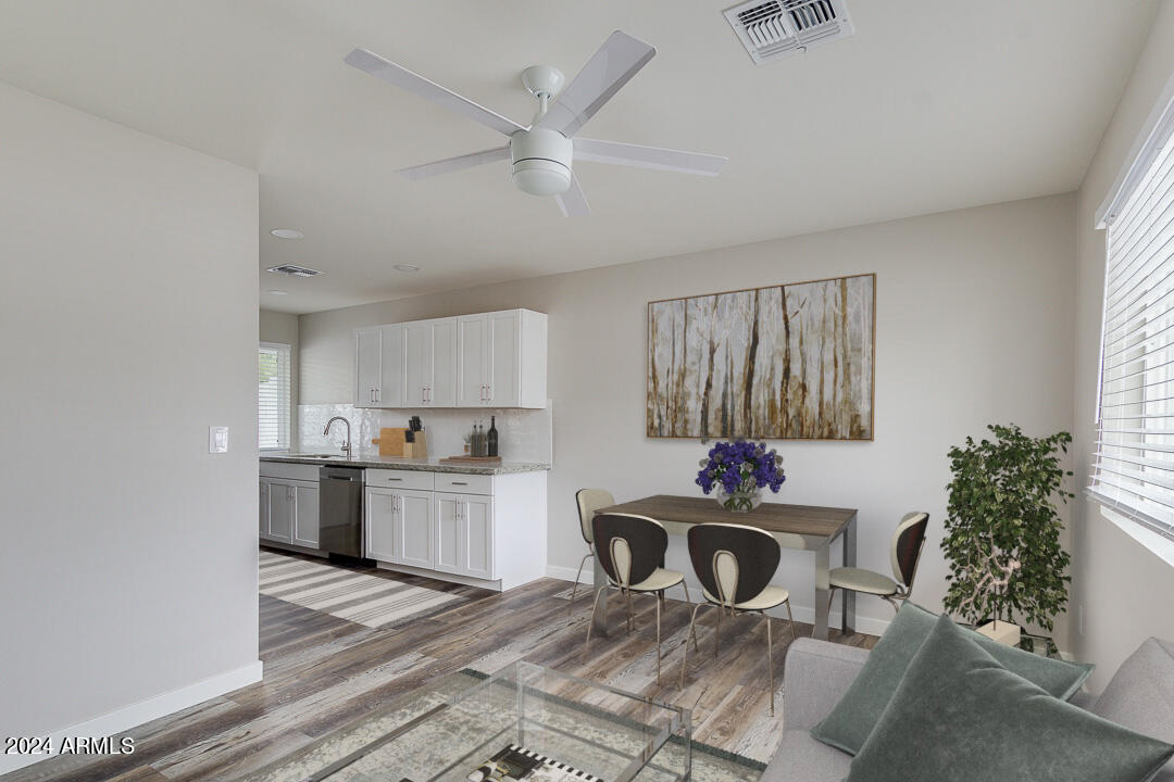 a kitchen with kitchen island granite countertop a stove a sink and a refrigerator