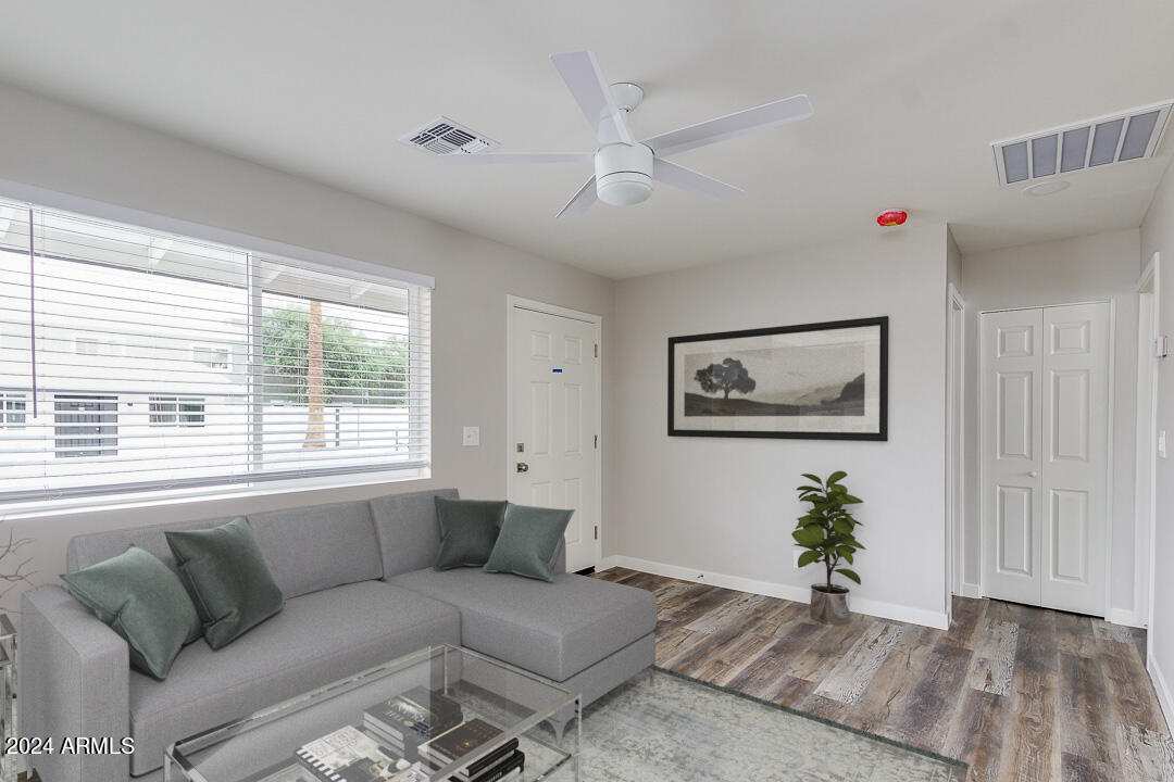 1648 West Colter Street, Unit 2 Phoenix, AZ 85015 - Photo 2 of 17 a living room with furniture and a window