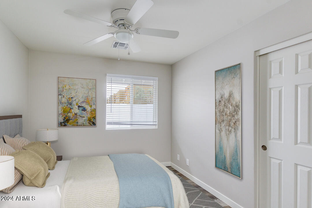 1648 West Colter Street, Unit 2 Phoenix, AZ 85015 - Photo 7 of 17 a bedroom with a bed and a window