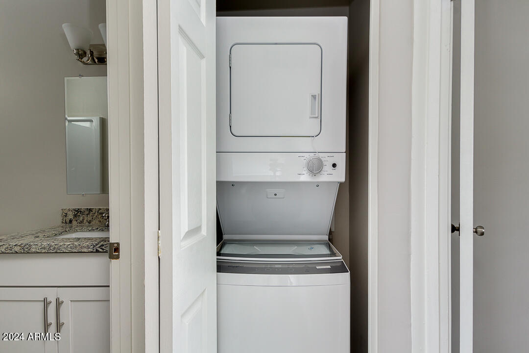 1648 West Colter Street, Unit 2 Phoenix, AZ 85015 - Photo 9 of 17 a stove top oven sitting inside of a kitchen